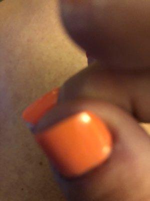 A chip off my middle finger nail one day after I got them done