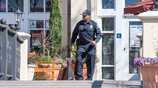 Conducting a foot patrol of a retail center.