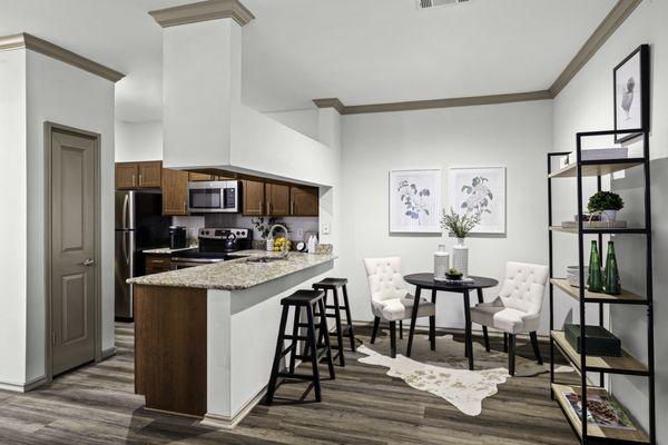 Dining room with view of kitchen at Mira Vista at La Cantera