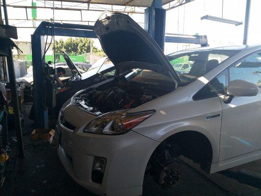 Two of the Toyota Prius 2nd GEN on the lifts. One undergoing engine swap and the other one is here for failed inverter-converter.