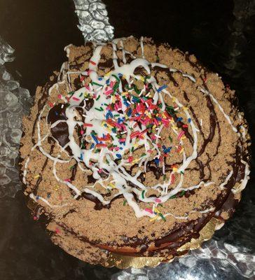 Rainbow cake with crumb topping and cannoli layer