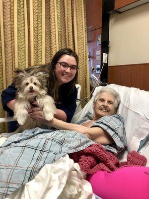 Visiting Grandma at the hospital. Grandma's nurse is holding Cannoli.