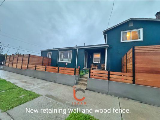 New retaining wall and wood fence.