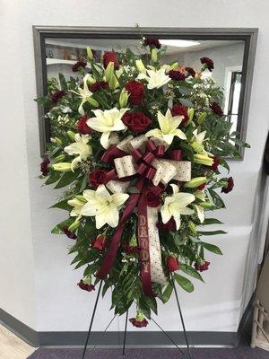 Standing spray with lilies and roses. $200.00