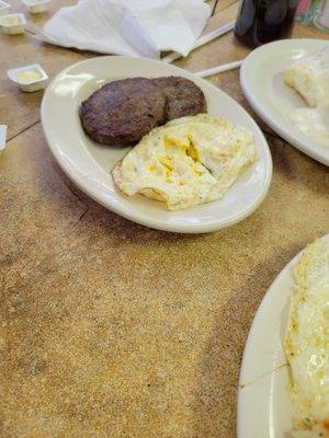 Sausage patties and 2 eggs