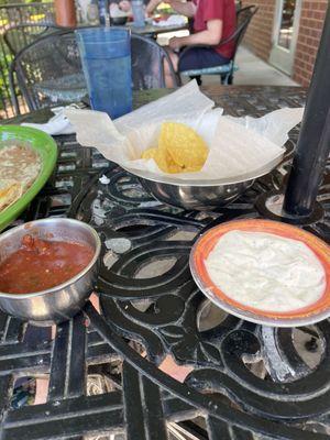 Chips and salsa with white sauce