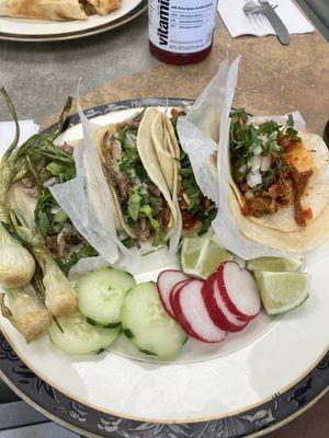 Al Pastor and Carnitas tacos.