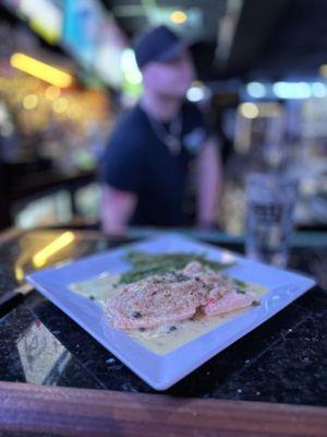 Crab -Stuffed Salmon BROILED SALMON STUFFED WITH CRAB MEAT IN A LEMON CAPER SAUCE SERVED WITH A SIDE SAUTEED GREEN BEANS.