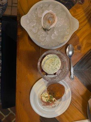 Starter course with oyster, beets, and potato chip