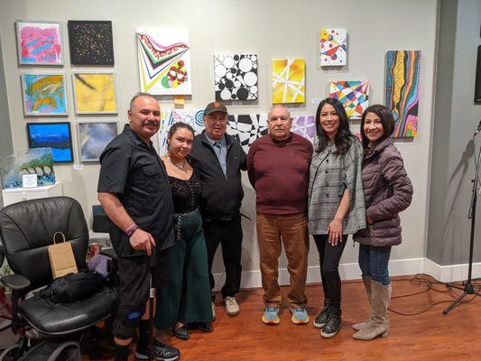 Artist Carlos Luis Olivas, Jr. and his son during his Artist Reception for his opening