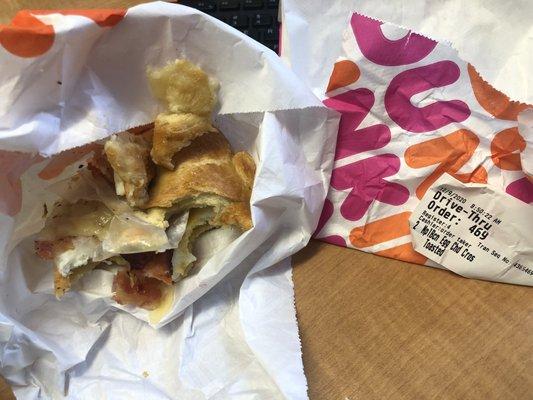 Showing the croissant with paper inside and date it was purchased