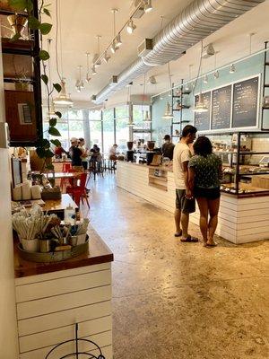 View of shop from back of shop looking towards front - bright, open, clean, inviting - loads of seating