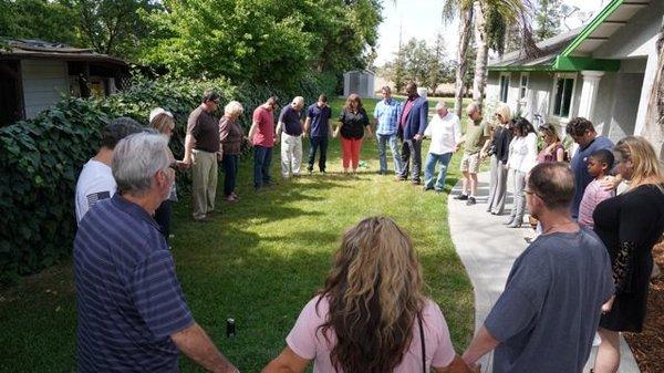 Praying over our new facility.