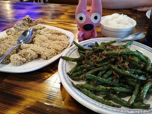 Pork chop and sautéed green beans.