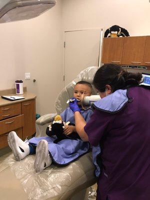 X-ray in progress, whoever thought my son would like going to the dentist hahaha he enjoys every minute of it thanks to dr. Sami