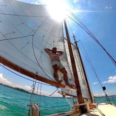 Captain Corey relaxing in the mainsail!