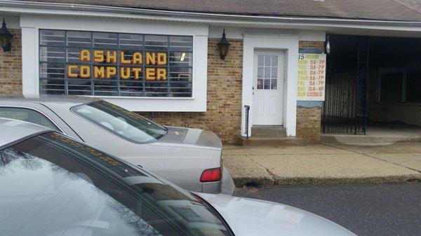 Store front with its hours.