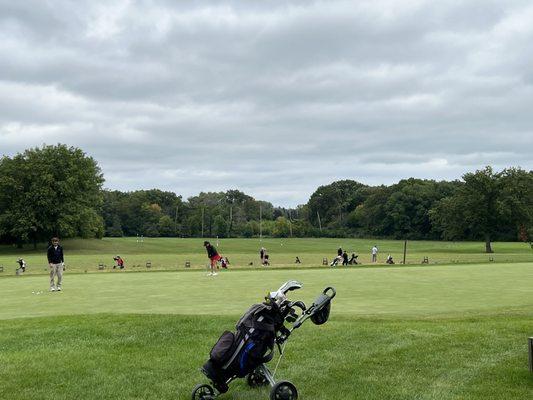 Putting green and warm up range behind.