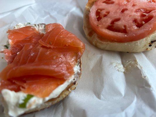 This skimpy salmon portion might feel intimidated by the burly tomato slice.