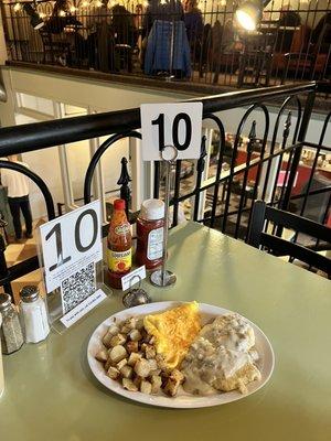 Biscuits & gravy with eggs and cheese and potatoes