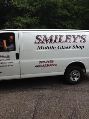 Smiley with his truck at our house. Great service!