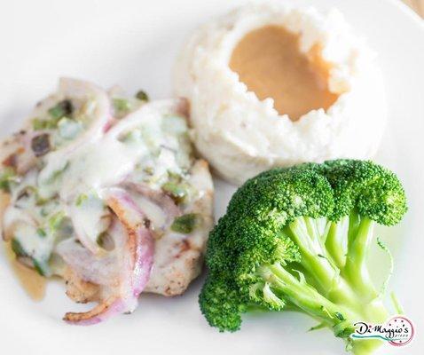 Our smothered Cajun chicken with mashed potatoes and broccoli