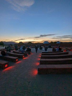 Very cool stone bench red courtesy light amphitheater Almost time for star gazing