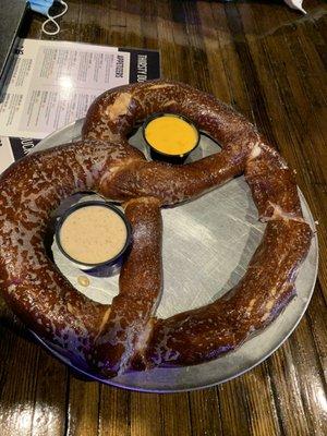 Giant pretzel with cheese and mustard