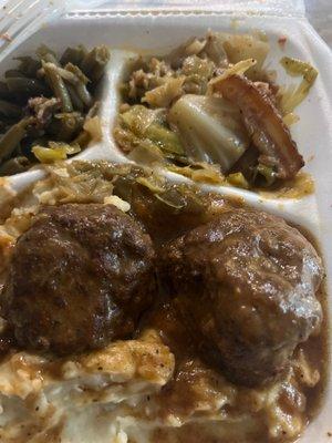 Smothered meatballs, cabbage, mashed potatoes and green beans.!