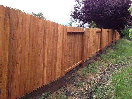 Redwood Dog Ear Good Neighbor Fence with Pressure Treated Kickboard