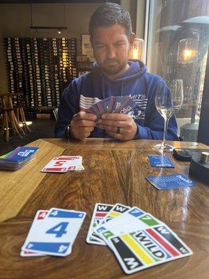 Table by the window, champagne and a game.