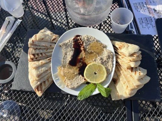 Baba ganoush dip, topped with honey and vinaigrette glaze.