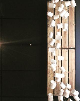 Window installation of hanging coffee mugs