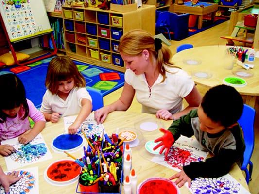 Carrie Edwards, teacher and owner working one on one with her students.