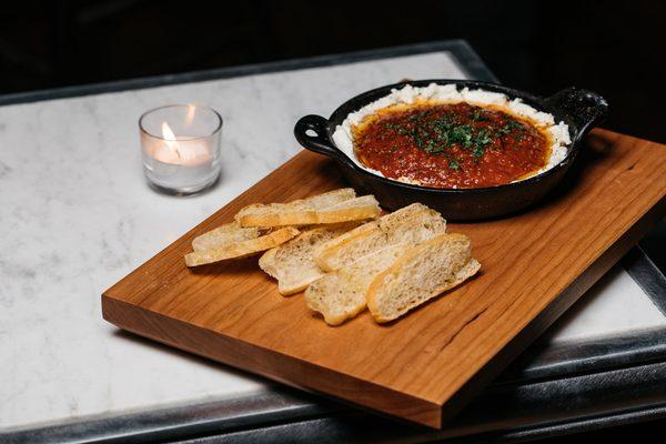 Brennan's Tomitican Sauce & Goat Cheese. Tomato, Garlic, Onion, Oregano, White Wine with Toasted Bread.