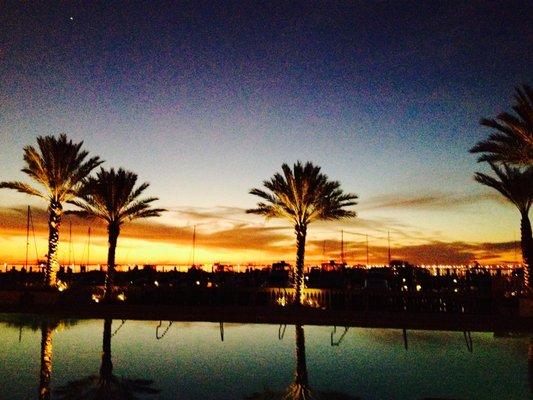 Just behind me in this photo is the neighborhood gym, overlooking the pool and water. Gorgeous sunsets.