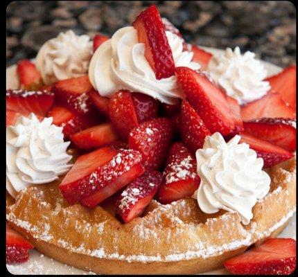 Waffles topped with fresh local strawberries