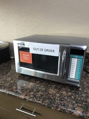 The only microwave in the dining area was broken