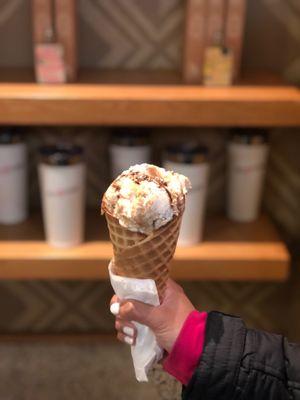 Peanut butter brittle caramel fudge with waffle cone