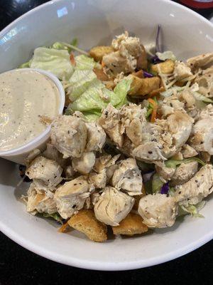 Chicken Caesar salad comes on mixed greens instead of traditional Romain. Tasty dressing & chicken