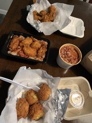 Jambalaya, fried chicken, hush puppies, red beans and rice.