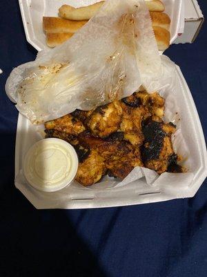 Honey BBQ Wings with bleu cheese and a side of Bread Sticks