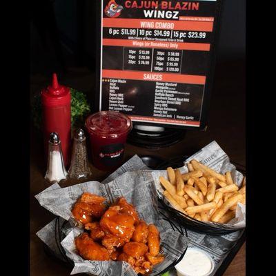 Mango Habanero Boneless Wingz with seasoned fries and a House Punch