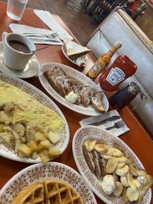 ham & cheese omelet w potatoes, raisin bread french toast, banana french toast, plain waffle.