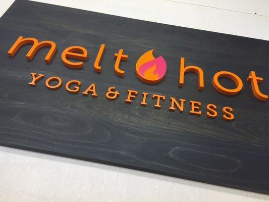 Acrylic painted signage on a wooden board