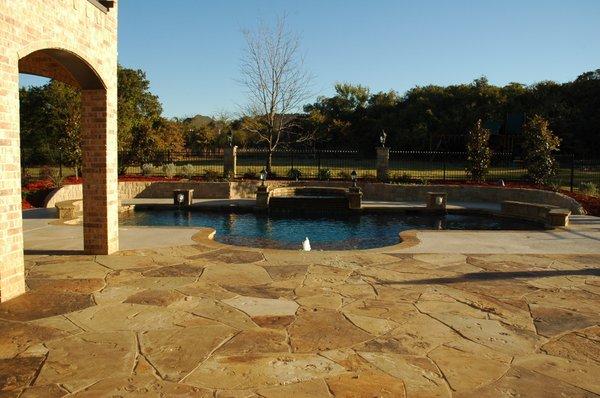 flagstone flooring surrounding pool