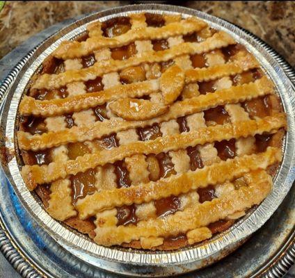 Deep Dish Peach Cobbler made a homemade buttered crust.