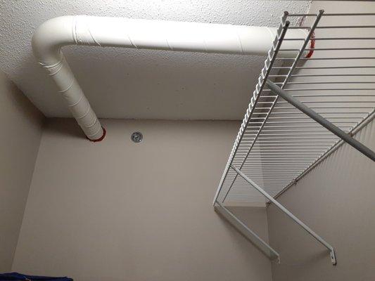 Exposed pipes in my bedroom closet.