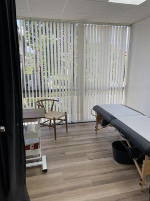 Comfortable exam table that is also used for acupuncture by the doctor that shares the office