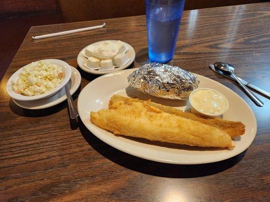 Two piece Perch dinner with baked potato and cole slaw.